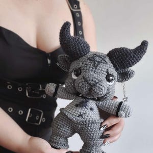 May include: A set of three ceramic mugs with a speckled, matte finish in cream, light grey, and dark grey. Each mug has a simple, minimalist design, ideal for coffee or tea.