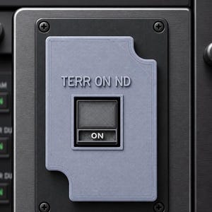 May include: A light gray, rectangular 3D-printed plastic cover plate featuring the text "TERR ON ND" embossed at the top. The cover has a central square cutout and a smaller rectangular cutout at the bottom containing a black switch labeled "ON".