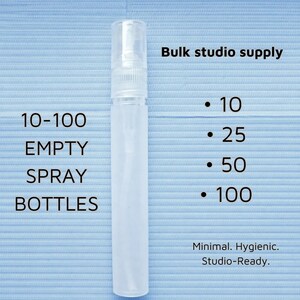 May include: A clear, empty spray bottle with a white cap, displayed on a light blue surface. Text reads "10-100 EMPTY SPRAY BOTTLES" and "Bulk studio supply." Additional text indicates quantities of 10, 25, 50, and 100.