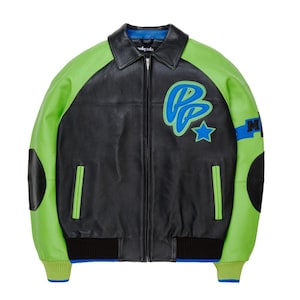 May include: A black and lime green leather jacket featuring a front zipper closure, a pointed collar, and ribbed cuffs. The chest displays a blue and lime green embroidered logo with a star, while black patches accent the elbows and sleeves.