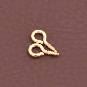 May include: A set of three ceramic mugs with a speckled, matte finish. The mugs are in shades of cream, light gray, and dark gray. Each mug has a simple, minimalist design, perfect for coffee or tea.