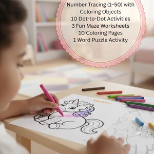 May include: A child is colouring a unicorn picture with a pink crayon. The image includes a pink and white circular graphic with text: Number Tracing (1-50) with Coloring Objects, 10 Dot-to-Dot Activities, 3 Fun Maze Worksheets, 10 Coloring Pages, and 1 Word Puzzle Activity.