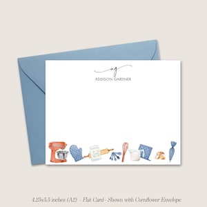 May include: A white flat card with a blue envelope. The card has a blue and red watercolor illustration of kitchen tools and the text "ag ADDISON GARDNER". The card measures 4.25 by 5.5 inches.