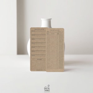 May include: Two brown paper reading log cards with the text "Memorable Quotes" and "Reading Log 2023". The cards have lined sections for notes and book details. The cards are in front of a white vase.