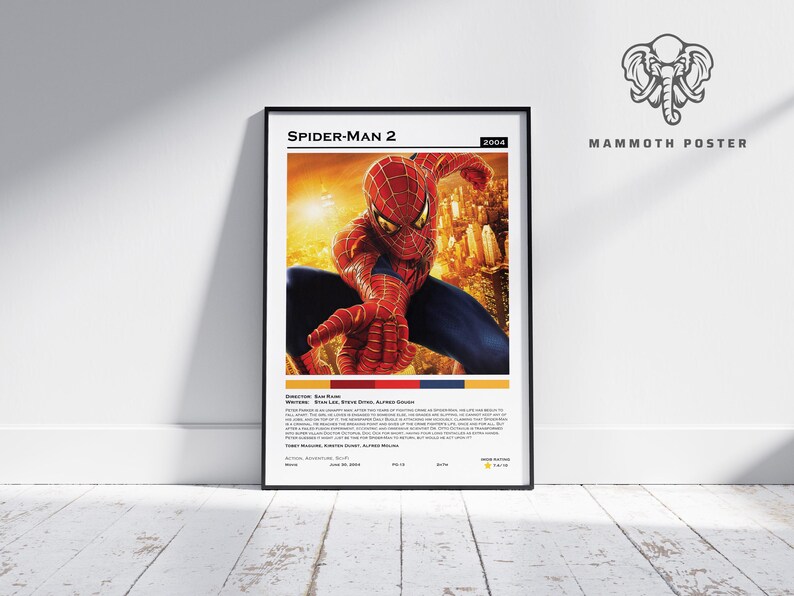 May include: A framed poster for the movie Spider-Man 2, featuring the superhero in a red and blue suit. The poster includes the film's title, year, and credits. The background is a cityscape.