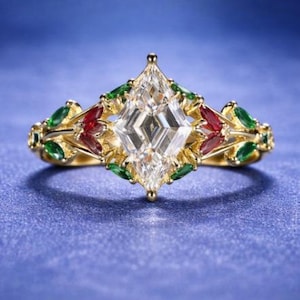 May include: A gold ring with a large, square-cut, clear gemstone at the center. The ring is adorned with green and red gemstones and intricate gold detailing. The ring is set against a blue background.