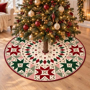 May include: A round Christmas tree skirt featuring a cream-colored base with a repeating pattern of red and dark green geometric stars, diamonds, and small holly leaf motifs, finished with a thin red border around the circular edge.
