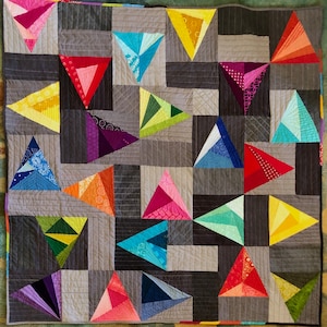 Modern quiltpatroon draaiende driehoeken