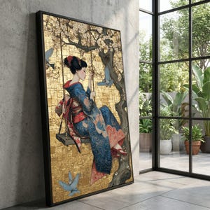 May include: Framed art print depicting a woman in a kimono on a swing, set against a gold mosaic background. The artwork shows cherry blossoms and blue birds. The woman is wearing a blue and red kimono.