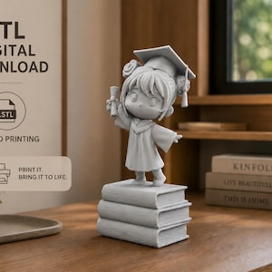 May include: A gray figurine of a graduate in a cap and gown, holding a diploma, standing on a stack of books. The image includes the text "STL DIGITAL DOWNLOAD" and "FOR 3D PRINTING".