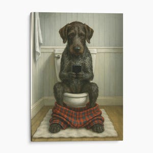 May include: A dark brown wire-haired dog sits on a white toilet, holding a black smartphone. The dog wears red and blue plaid pants pulled down around its ankles. The scene is set in a bathroom with light blue paneled walls and a white towel.
