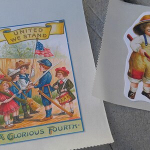May include: Two paper sheets. One features a vintage illustration with children, an American flag, and the text "UNITED WE STAND" and "A GLORIOUS FOURTH." The other has a sticker of a child in overalls holding an axe.