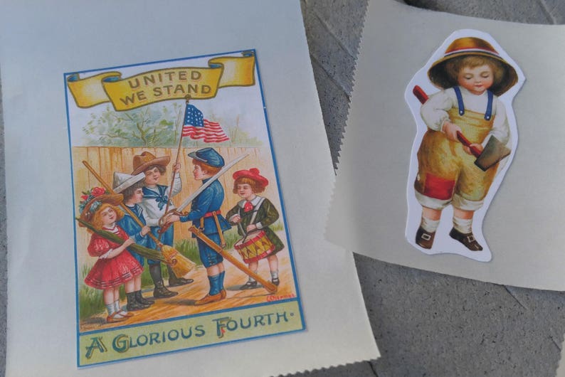 May include: Two paper sheets. One features a vintage illustration with children, an American flag, and the text "UNITED WE STAND" and "A GLORIOUS FOURTH." The other has a sticker of a child in overalls holding an axe.