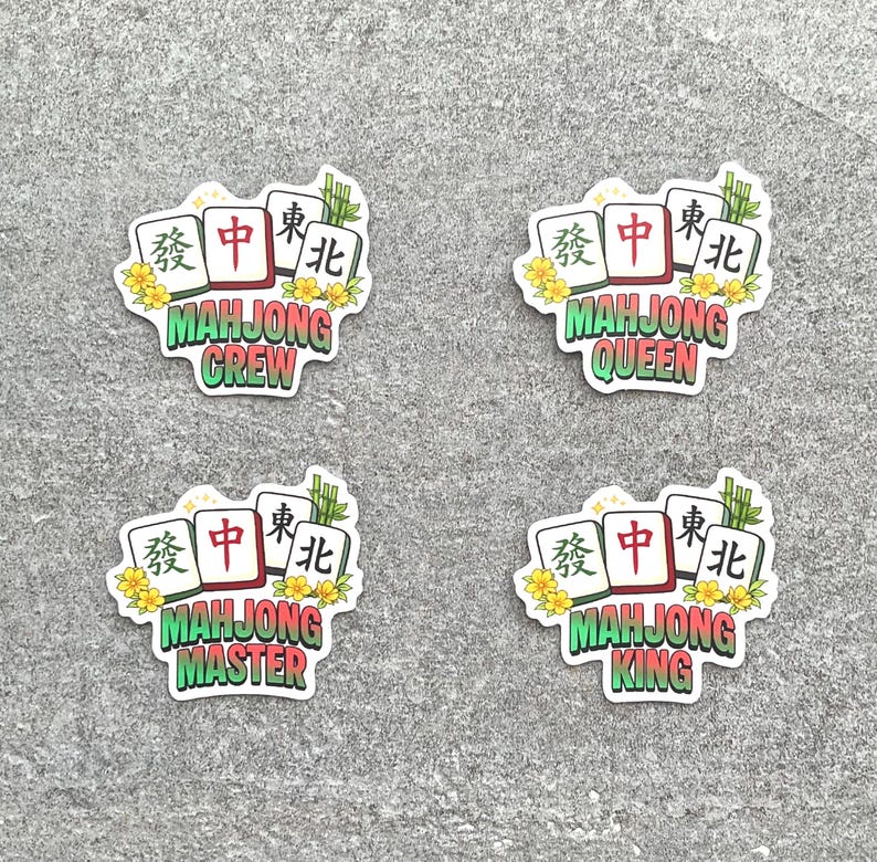 May include: Four stickers with a Mahjong theme. Each sticker features three Mahjong tiles, yellow flowers, and bamboo. The stickers have the words "Mahjong Crew", "Mahjong Queen", "Mahjong Master", and "Mahjong King".