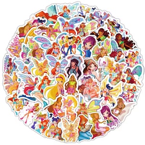 May include: A circular arrangement of colourful stickers depicting fairy characters with wings. The stickers feature various poses and outfits, with vibrant colours including pink, yellow, blue, and green. The stickers are set against a white background.