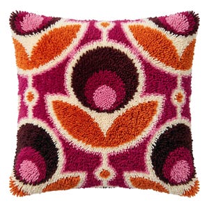 May include: A square throw pillow featuring a textured, tufted surface with a symmetrical floral-inspired pattern. The design incorporates vibrant shades of magenta, deep burgundy, bright orange, and cream in a repeating geometric arrangement.