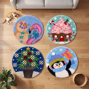 May include: Four circular tufted rugs featuring seasonal designs: a snowman with a pink flamingo, a gingerbread house with frosting, a decorated Christmas tree in a pot, and a penguin wearing a blue hat and scarf holding a gift.