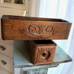 May include: A set of three ceramic mugs with a speckled, matte finish. The mugs are in shades of cream, light gray, and dark gray. Each mug has a simple, minimalist design and a rounded handle. Perfect for coffee or tea.