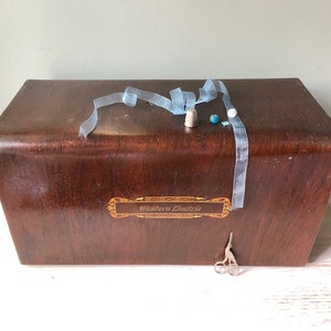 A Sewing machine tiger Wood Carryng Case Western Electric