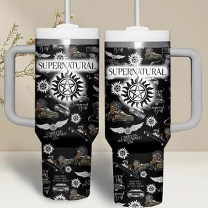 May include: Two black and white Supernatural-themed tumblers with handles and straws. The design includes the show's logo, images of the Impala, and the text "Carry on my wayward son."