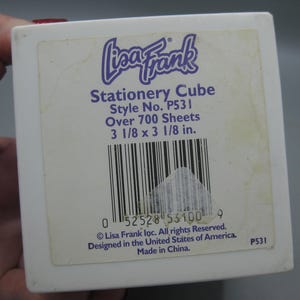 May include: A white ceramic mug with a black handle and the text "But First, Coffee" in a black, handwritten-style font. The mug is on a white surface.