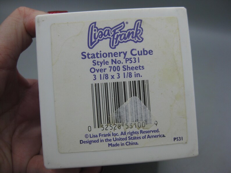 May include: A white ceramic mug with a black handle and the text "But First, Coffee" in a black, handwritten-style font. The mug is on a white surface.