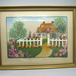 May include: A white ceramic mug with a black handle and the text "But First, Coffee" in a bold, black font. The mug is set against a blurred background, suggesting a cozy setting.