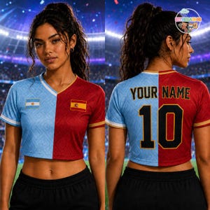May include: A split-design crop top featuring a light blue side with the Argentina flag and a red side with the Spain flag. The back displays the text YOUR NAME and the number 10 in black with gold outlines, set against a stadium background.