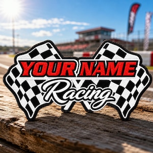 May include: A custom embroidered patch featuring two crossed checkered racing flags in black and white. The patch displays the text YOUR NAME in bold red capital letters and the word Racing in a white cursive script font with a black outline.