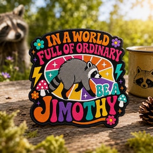 May include: A black embroidered patch featuring a central illustration of a gray raccoon. The text reads, "IN A WORLD FULL OF ORDINARY BE A JIMOTHY." The design includes colorful mushrooms, flowers, lightning bolts, and a vibrant sunburst background.