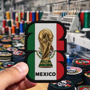 May include: Embroidered patch in the shape of the number 3, featuring the Mexican flag colors of green, white, and red. The patch includes a gold-colored FIFA World Cup trophy and the word "MEXICO".