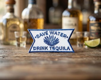 May include: A rectangular embroidered patch with a white background and blue border. The text reads SAVE WATER in the top section and DRINK TEQUILA in the bottom section, with a blue agave plant illustration centered between the two lines of text.