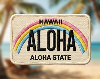 May include: A rectangular embroidered patch with a cream-colored background. It features a rainbow arching over the black text ALOHA. Above the rainbow is the word HAWAII, and below the rainbow is the text ALOHA STATE, all in black embroidery.