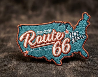 May include: Embroidered patch in the shape of the United States, featuring the text "Route 66" in a vintage style. The patch is teal with orange and white accents, celebrating 100 years of Route 66 from 1926-2026.