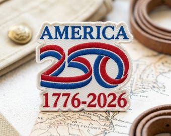 May include: A rectangular embroidered patch with a white background. The text AMERICA is in blue, followed by a stylized 250 in red and blue ribbon-like font. Below, the years 1776-2026 are embroidered in red. The patch has a scalloped edge.