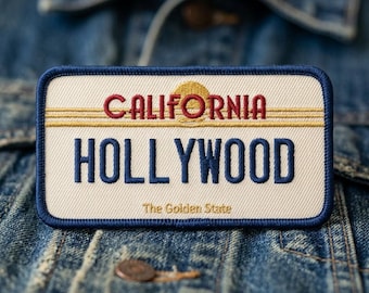 May include: A rectangular patch with a blue border and the words "CALIFORNIA HOLLYWOOD" in red and blue embroidery. The patch also features a gold sun design and the text "The Golden State".