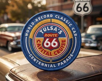 May include: A circular embroidered patch featuring a blue border with the text WORLD-RECORD CLASSIC CAR CENTENNIAL PARADE. The center displays a red, white, and blue shield with the text TULSA'S ROUTE 66 CAPITAL CRUISE and the number 66.