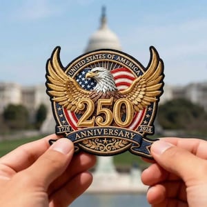 May include: Embroidered patch commemorating the 250th anniversary of the United States of America. The patch features a golden eagle with outstretched wings, the American flag, and the text "250 Anniversary" with the years 1776 and 2026.