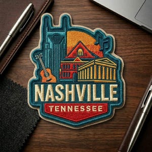 May include: Embroidered patch featuring Nashville, Tennessee landmarks. The design includes a guitar, buildings, and musical notes, with the city name and state name prominently displayed in a stylized font. The patch has a teal, orange, red, and gold color scheme.
