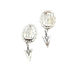 Concho Arrowhead Earrings: Silver Oval Charms, Pierced Design