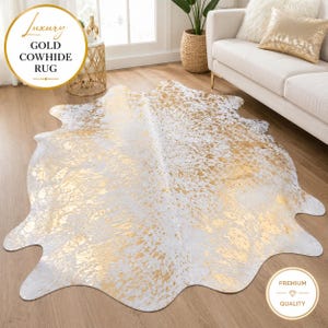 May include: A cowhide rug featuring a white base with a metallic gold foil pattern across the surface. The rug has an irregular, organic shape characteristic of a natural hide. Text on the image reads: Luxury GOLD COWHIDE RUG and PREMIUM QUALITY.