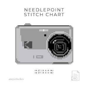 May include: A grayscale needlepoint stitch chart featuring a pixelated camera design. The chart includes text that reads "NEEDLEPOINT STITCH CHART" and measurements of 14 CT (5 x 4 in) and 18 CT (4 x 3 in). A PDF icon is also present.