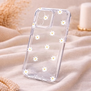 以下が含まれることがあります： 黒い持ち手と「But First, Coffee」の文字が黒い太字でプリントされた白いセラミックマグ。マグカップは白い面に置かれています。マグカップの高さは約10cmです。