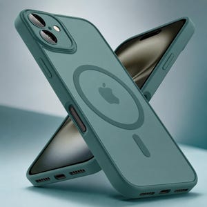 May include: A matte teal silicone phone case featuring a circular MagSafe magnetic ring and a central Apple logo. The case includes a raised camera bump with two circular lens cutouts, side buttons, and bottom speaker and charging port openings.