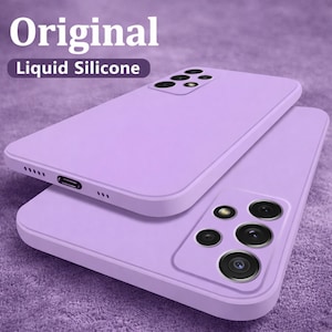 May include: Two lavender liquid silicone phone cases. The cases are stacked, with one slightly offset from the other. The top case has the text "Original" and "Liquid Silicone" in white. The bottom case has a camera array.