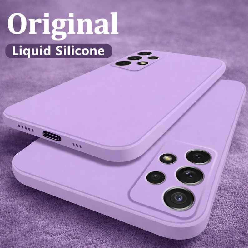 May include: Two lavender liquid silicone phone cases. The cases are stacked, with one slightly offset from the other. The top case has the text "Original" and "Liquid Silicone" in white. The bottom case has a camera array.