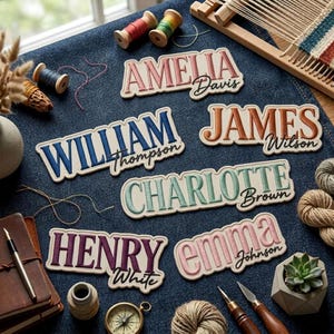 May include: Six custom embroidered name patches on a dark blue denim fabric. The patches feature names in various colors and fonts, including Amelia Davis, William Thompson, James Wilson, Charlotte Brown, Henry White, and Emma Johnson.