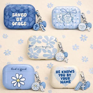 May include: A collection of blue and white AirPod cases with religious themes. Designs include floral patterns, crosses, and phrases like "Saved by Grace" and "Jesus Loves You." Each case has a charm with a cross and heart.