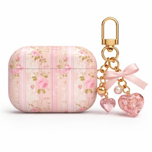 May include: A pink and cream floral patterned AirPod case with a gold keychain. The case has a vertical stripe design with pink roses. The keychain has a pink bow, two heart charms, and a pearl.