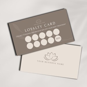 May include: Two rectangular loyalty cards. The top card is taupe with the words "LOYALTY CARD" and "COLLECT 10 STAMPS AND RECEIVE 50% OFF YOUR NEXT TREATMENT" in white. The bottom card is light beige with a lotus flower logo.